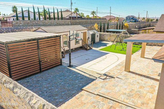 view of patio / terrace with a shed