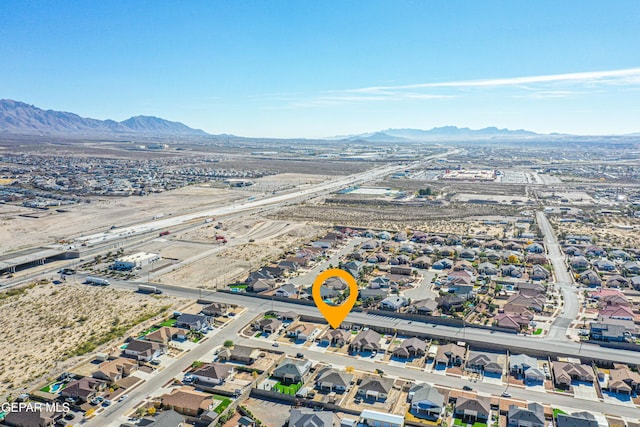 birds eye view of property featuring a mountain view