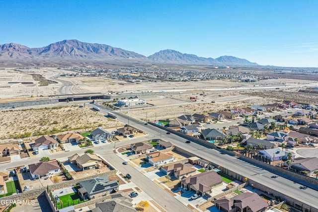 birds eye view of property with a mountain view