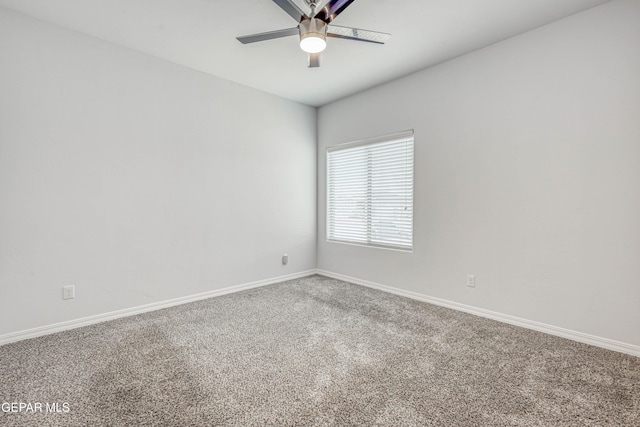 empty room with carpet flooring and ceiling fan