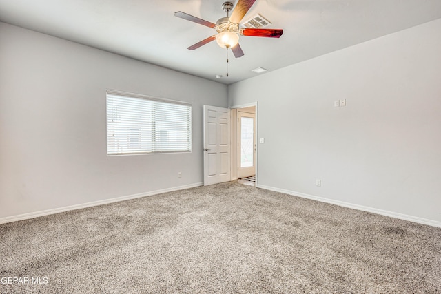 empty room with carpet and ceiling fan