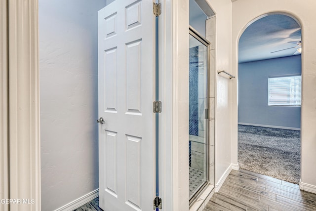 corridor featuring hardwood / wood-style flooring