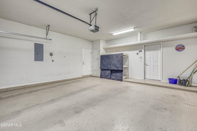 garage with a garage door opener and electric panel