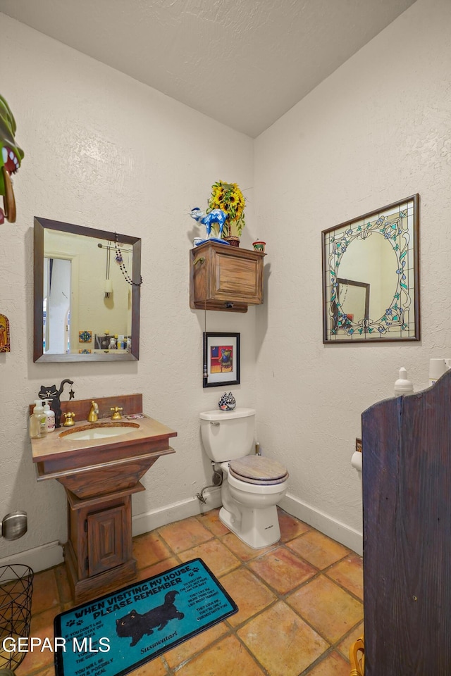 1117 Kerbey Ave, El Paso, TX 79902 - half bathroom featuring toilet and tile patterned floors