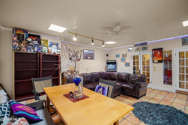 dining room featuring light tile patterned floors, french doors, and ceiling fan