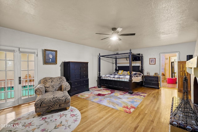1117 Kerbey Ave, El Paso, TX 79902 - bedroom featuring hardwood / wood-style floors, a textured ceiling, and ceiling fan