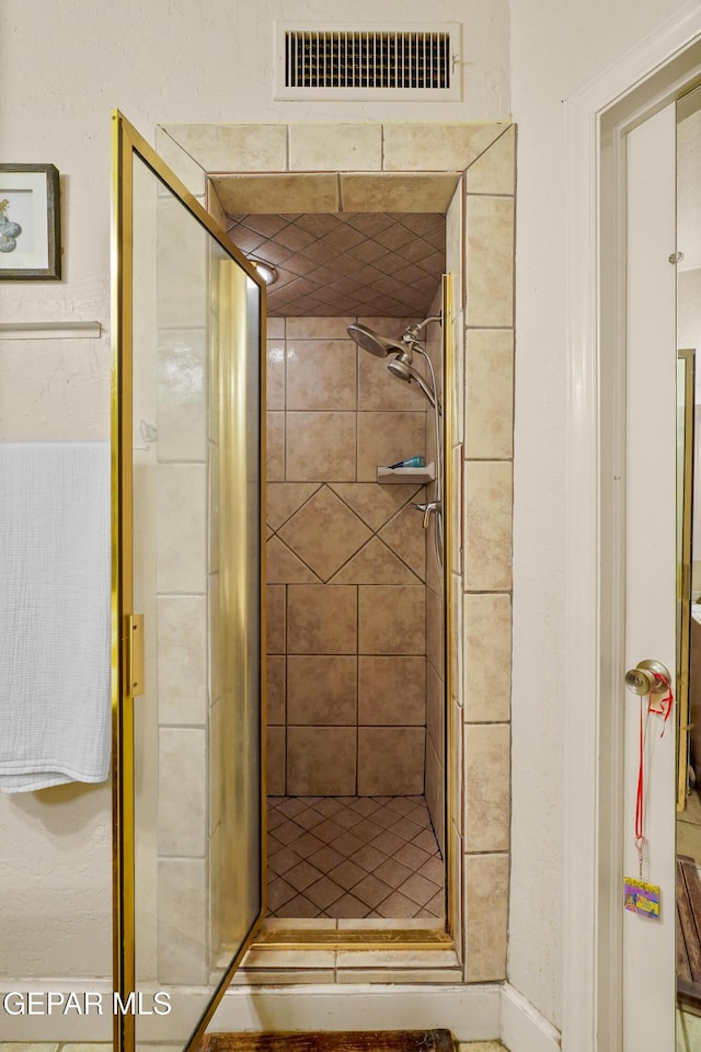 bathroom featuring an enclosed shower