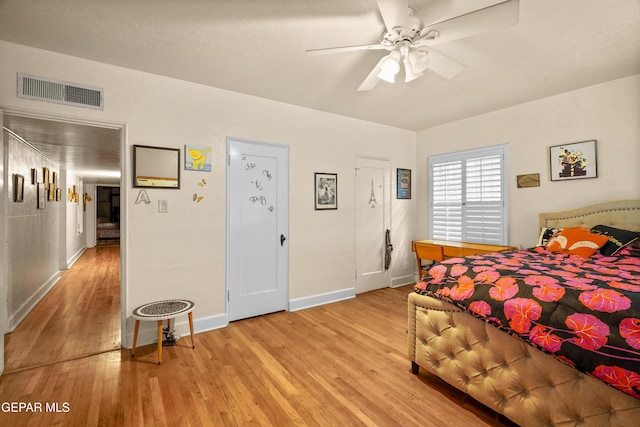 bedroom featuring ceiling fan and light hardwood / wood-style floors