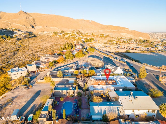 birds eye view of property featuring a mountain view