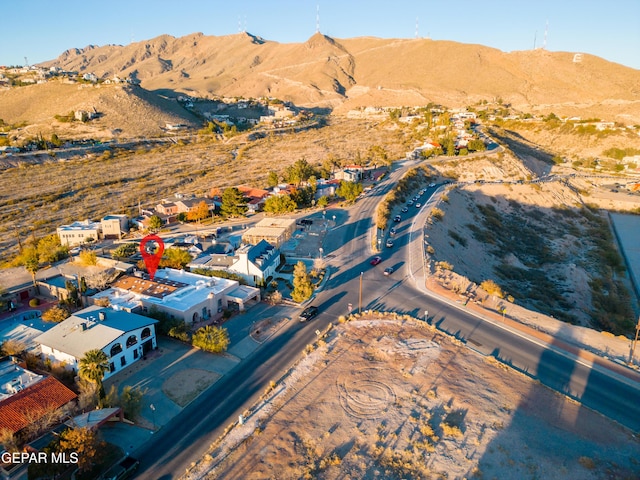 birds eye view of property with a mountain view