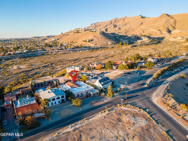 birds eye view of property featuring a mountain view