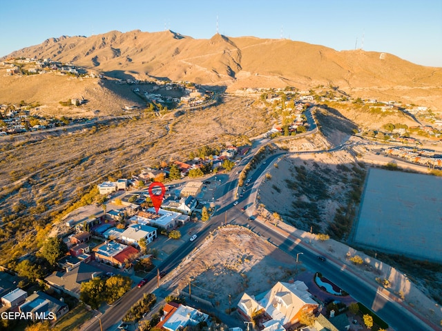 birds eye view of property featuring a mountain view