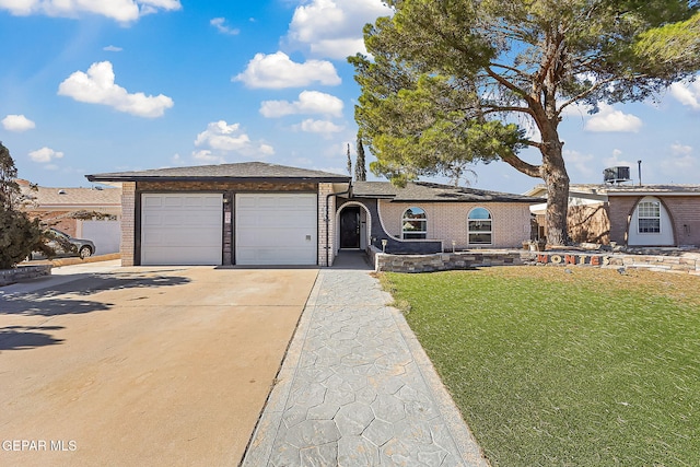 ranch-style house with a front yard and a garage