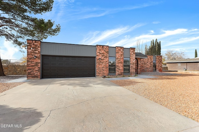 17001 Darrington Rd, Horizon City, TX 79928 - contemporary home featuring concrete driveway and an attached garage