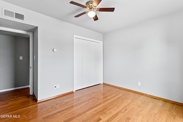 17001 Darrington Rd, Horizon City, TX 79928 - unfurnished bedroom featuring a closet, wood finished floors, and a ceiling fan