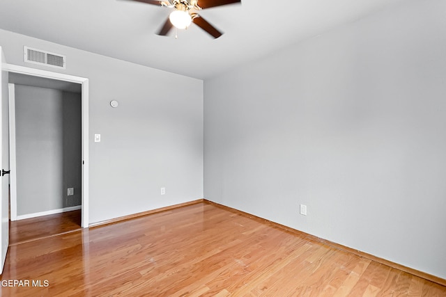 spare room featuring ceiling fan and wood-type flooring