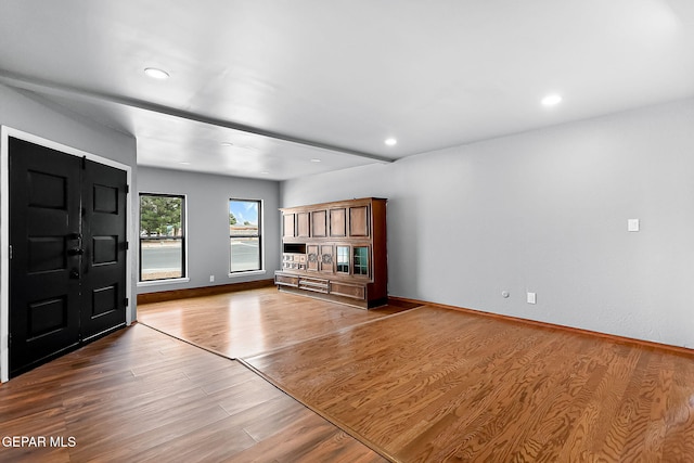 17001 Darrington Rd, Horizon City, TX 79928 - unfurnished living room with wood finished floors and recessed lighting