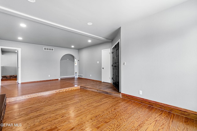 17001 Darrington Rd, Horizon City, TX 79928 - unfurnished room featuring arched walkways, wood finished floors, and recessed lighting
