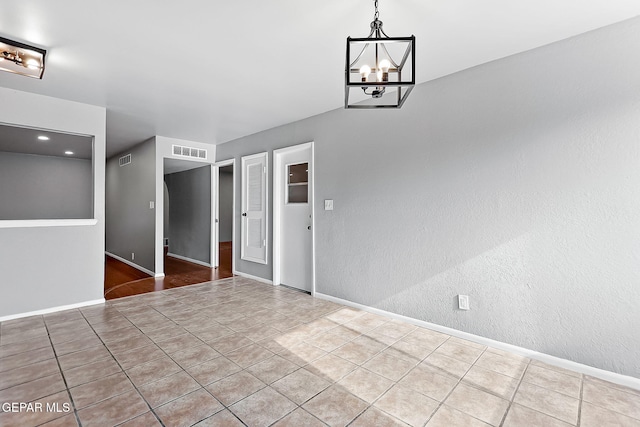17001 Darrington Rd, Horizon City, TX 79928 - unfurnished room with a chandelier and tile patterned floors