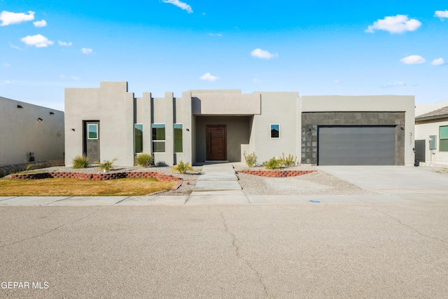 adobe home featuring a garage