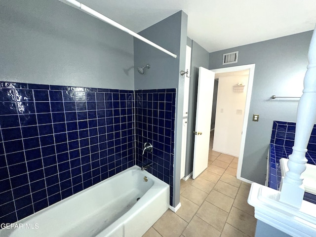 bathroom featuring tile patterned flooring and bathtub / shower combination