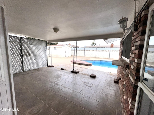 view of pool featuring a patio