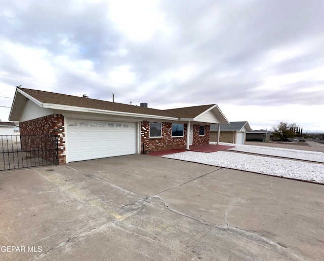 ranch-style home with a garage