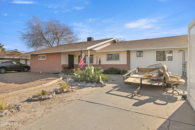 single story home featuring a patio