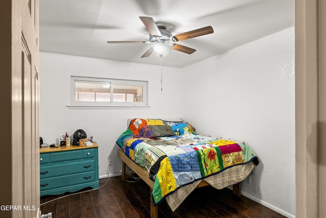 bedroom with dark hardwood / wood-style floors and ceiling fan