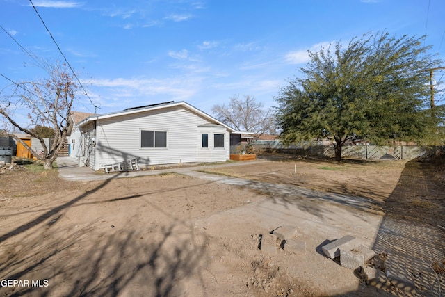 back of property with a patio