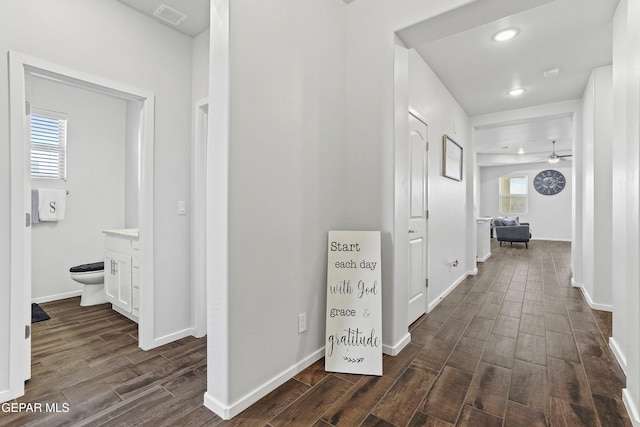 corridor with dark wood-type flooring