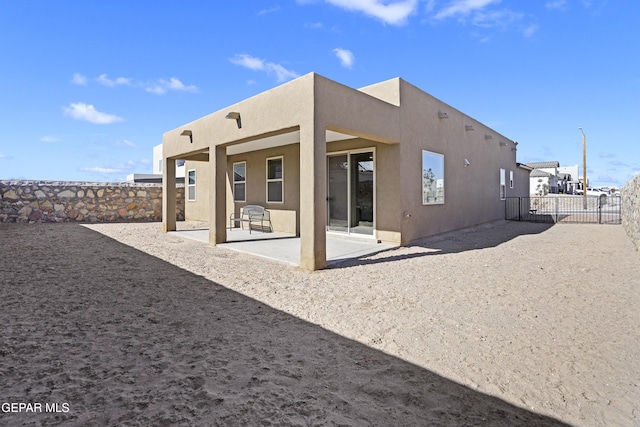 back of house featuring a patio