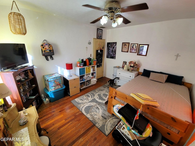 bedroom featuring hardwood / wood-style floors and ceiling fan