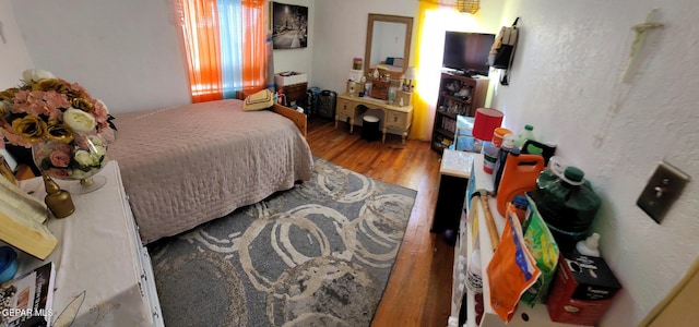 bedroom featuring hardwood / wood-style flooring