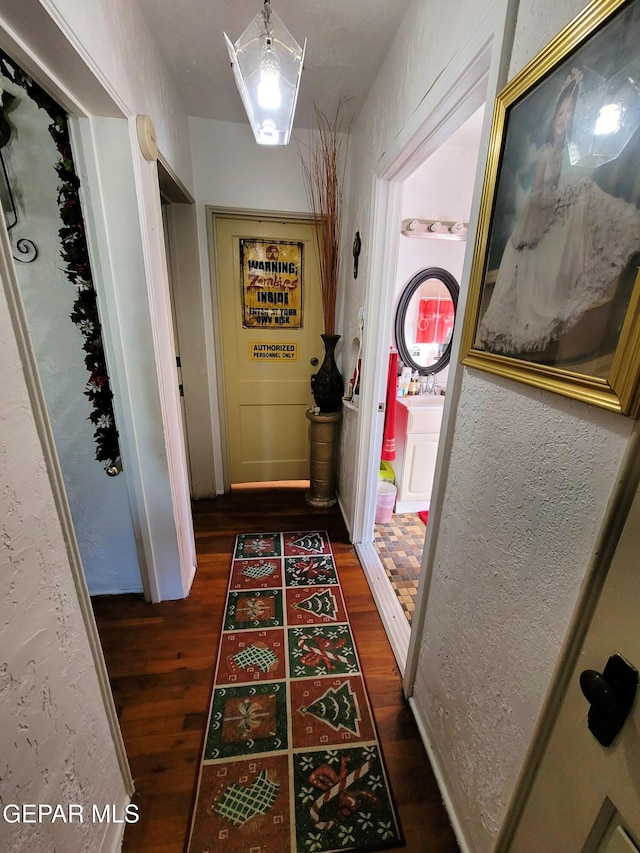 hallway featuring dark hardwood / wood-style flooring