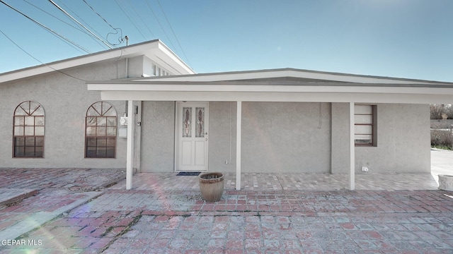 rear view of property featuring a patio area