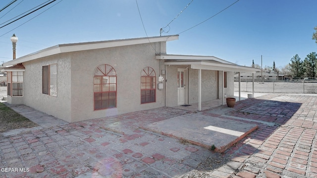 rear view of house featuring a patio