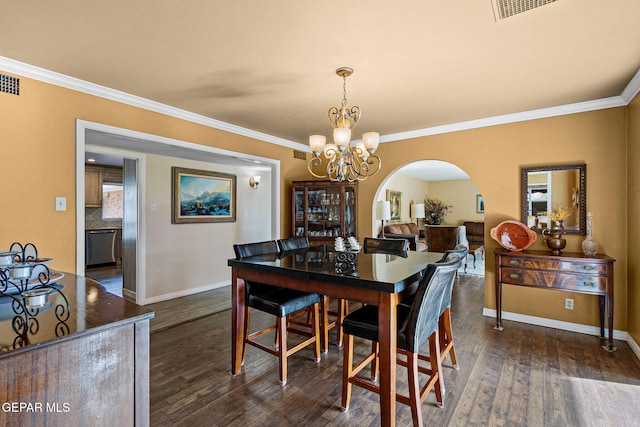 dining room with ornamental molding, a notable chandelier, and dark hardwood / wood-style flooring