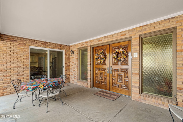 doorway to property featuring a patio and french doors