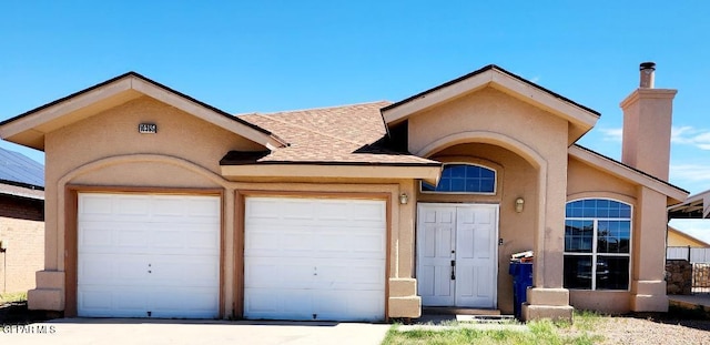 view of front of home with a garage