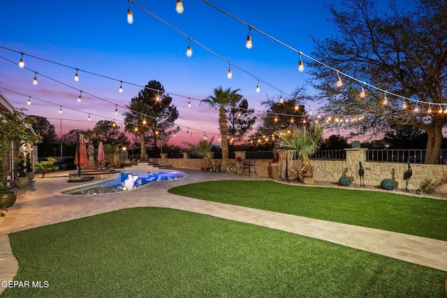 11179 Leo Collins Dr, El Paso, TX 79936 - yard at dusk featuring a patio area
