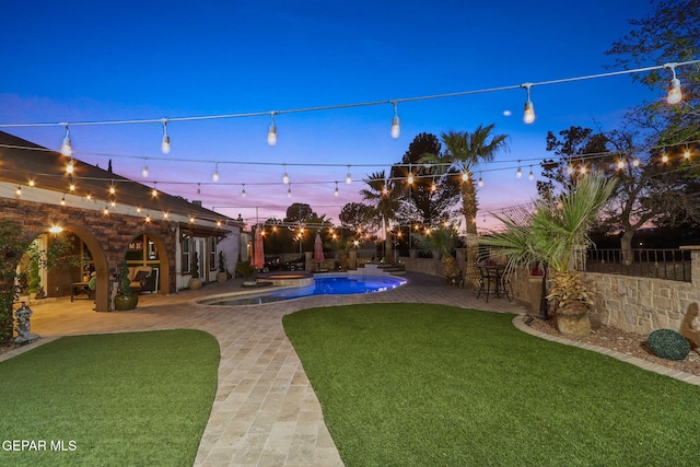 11179 Leo Collins Dr, El Paso, TX 79936 - yard at dusk with a patio and a fenced backyard