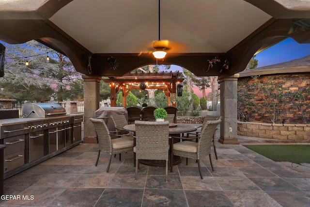 11179 Leo Collins Dr, El Paso, TX 79936 - view of patio with exterior kitchen, outdoor dining space, and a gazebo