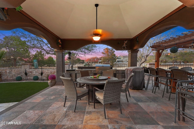 11179 Leo Collins Dr, El Paso, TX 79936 - patio terrace at dusk featuring outdoor dining space, area for grilling, and a patio