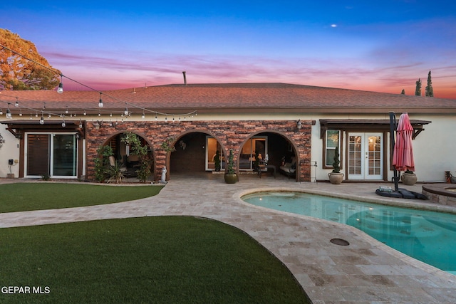 11179 Leo Collins Dr, El Paso, TX 79936 - back of property with french doors, a patio, a shingled roof, and an outdoor pool