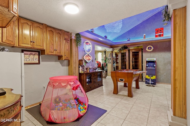 11179 Leo Collins Dr, El Paso, TX 79936 - recreation room with light tile patterned floors and a textured ceiling
