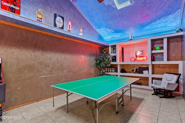 11179 Leo Collins Dr, El Paso, TX 79936 - recreation room with built in shelves, tile patterned floors, and lofted ceiling