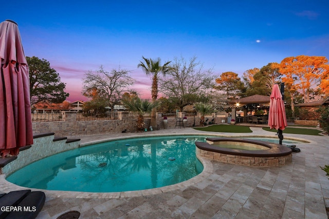 11179 Leo Collins Dr, El Paso, TX 79936 - view of pool featuring a patio area, a fenced backyard, a gazebo, and a pool with connected hot tub