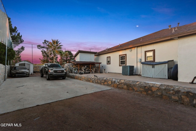 11179 Leo Collins Dr, El Paso, TX 79936 - property exterior at dusk with stucco siding