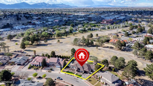 11179 Leo Collins Dr, El Paso, TX 79936 - aerial perspective of suburban area featuring property parcel outlined and mountains